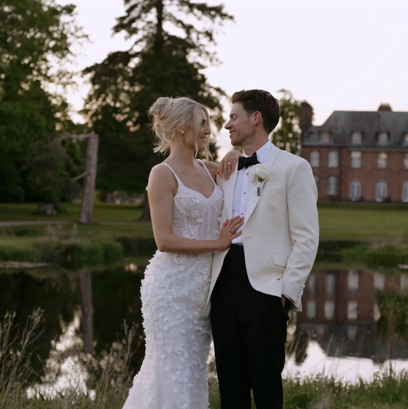 A couple by a lake in front of a country house, graded, from a PS Visuals film